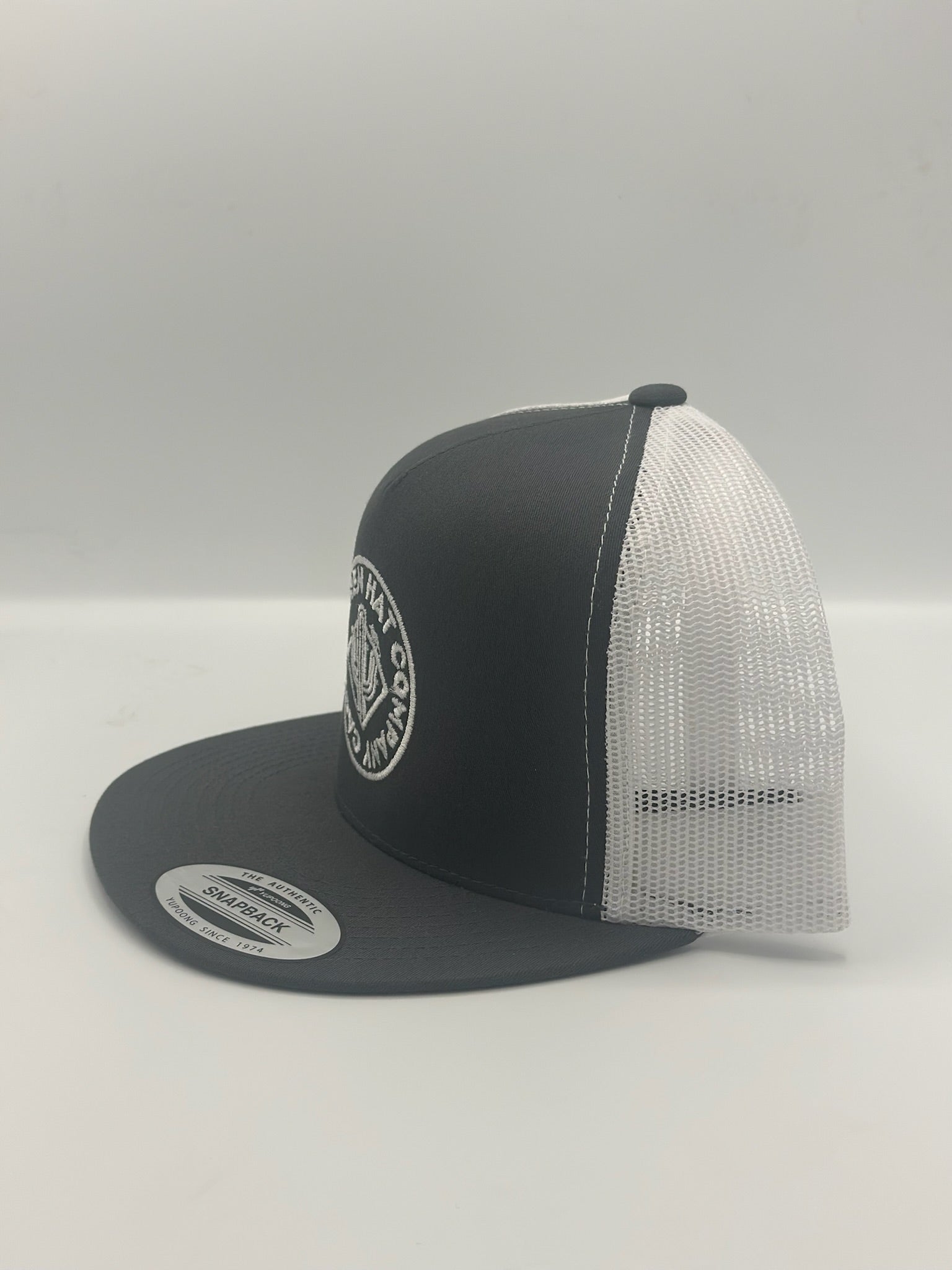 Round Ranch Logo in charcoal gray/white